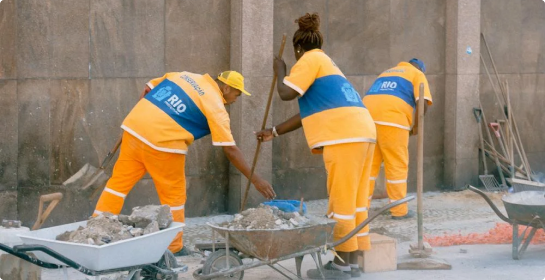 Aquasoltech team cleaning up a San Diego residential site after seamless gutter and patio cover installation, showing professional post-installation service and attention to detail.