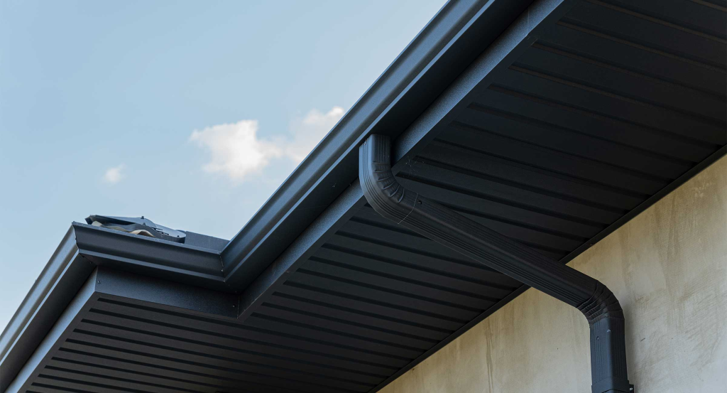 Aquasoltech comparing different gutter material options on display in San Diego, illustrating how to choose the right gutter material for seamless gutter installation and long‑lasting rainwater protection.